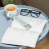 دانلود فایل forooshonline.ir فتوشاپ PSD و لایه باز موکاپ کتاب با کیفیت بالا طرح کتاب باز عینک و فنجان